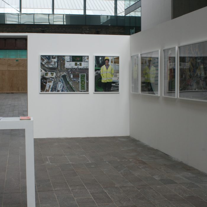 Gallery panels with images of workers