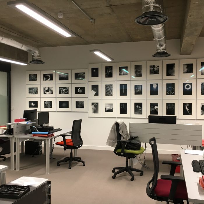 B/w photos on an office wall