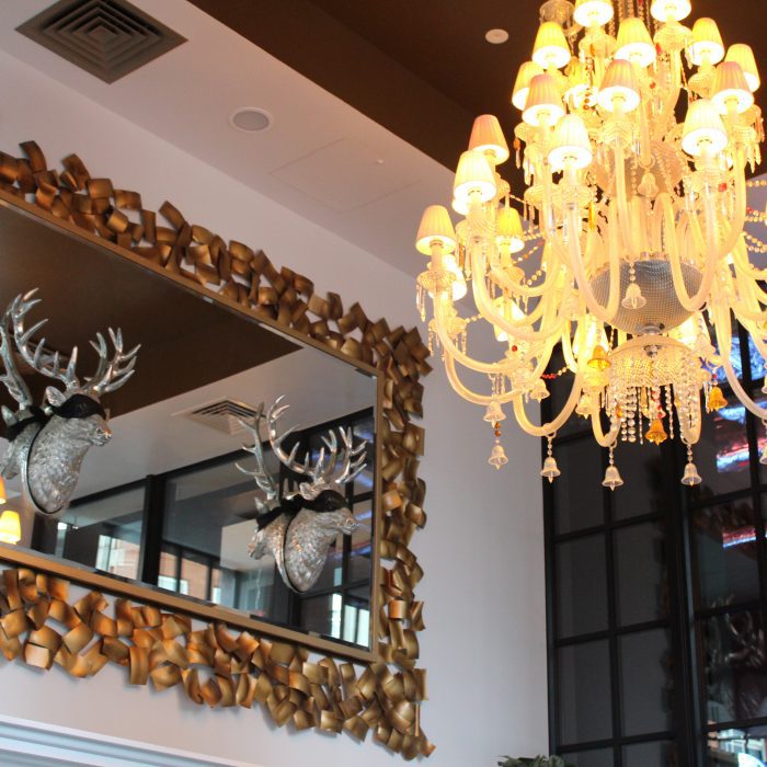 A mirror with 2 deer heads