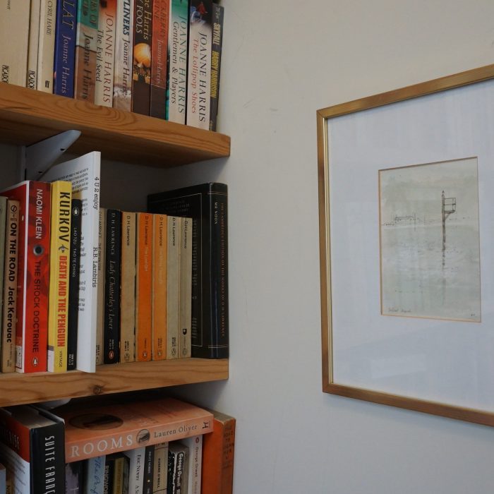 A bookshelf and a drawing