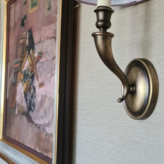 A details of a lamp holder and a painting